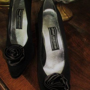 Evelyn is bringing you Stuart Weitzman gorgeous black silk shoes.